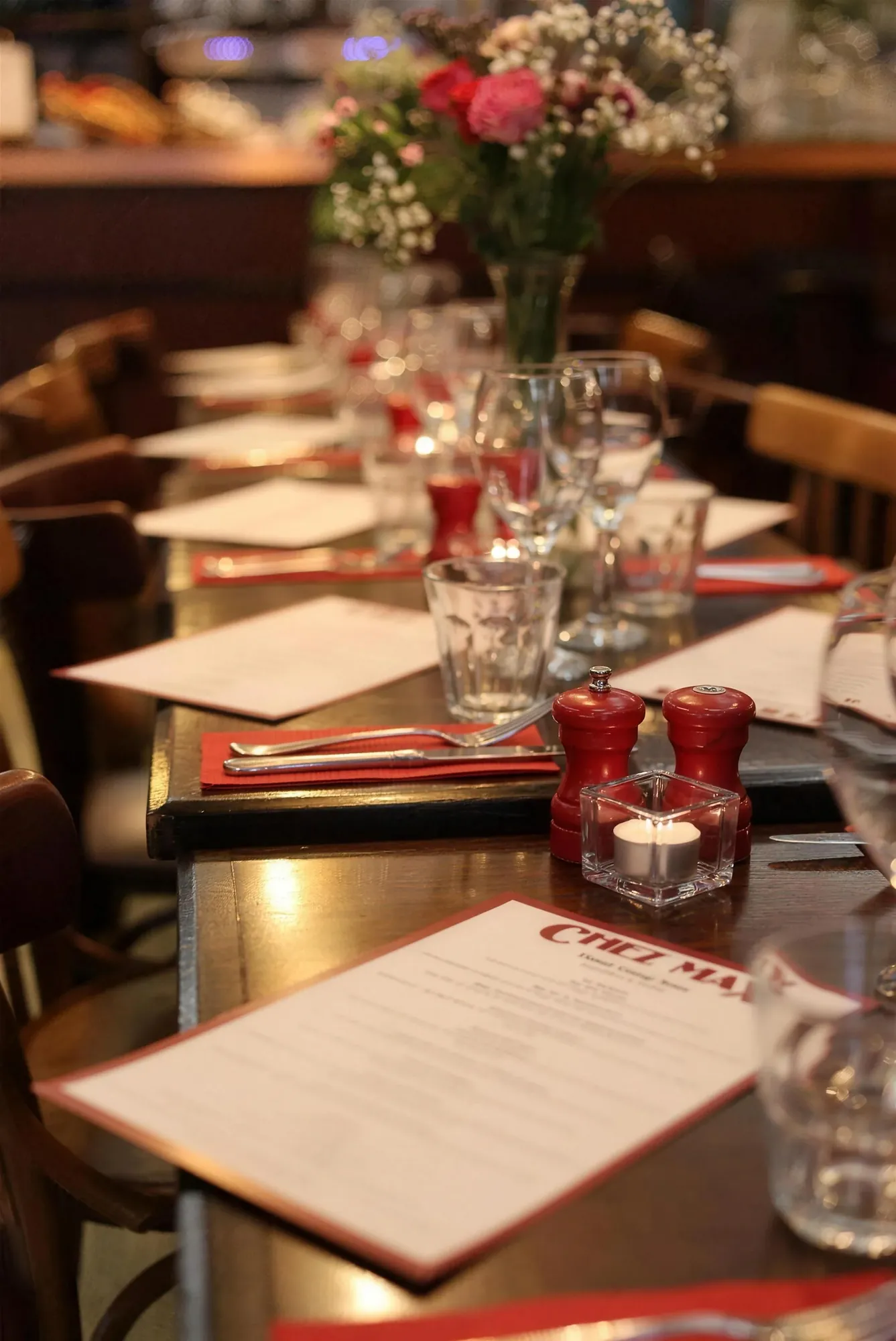 A long table dressed for a group lunch at Chez Max