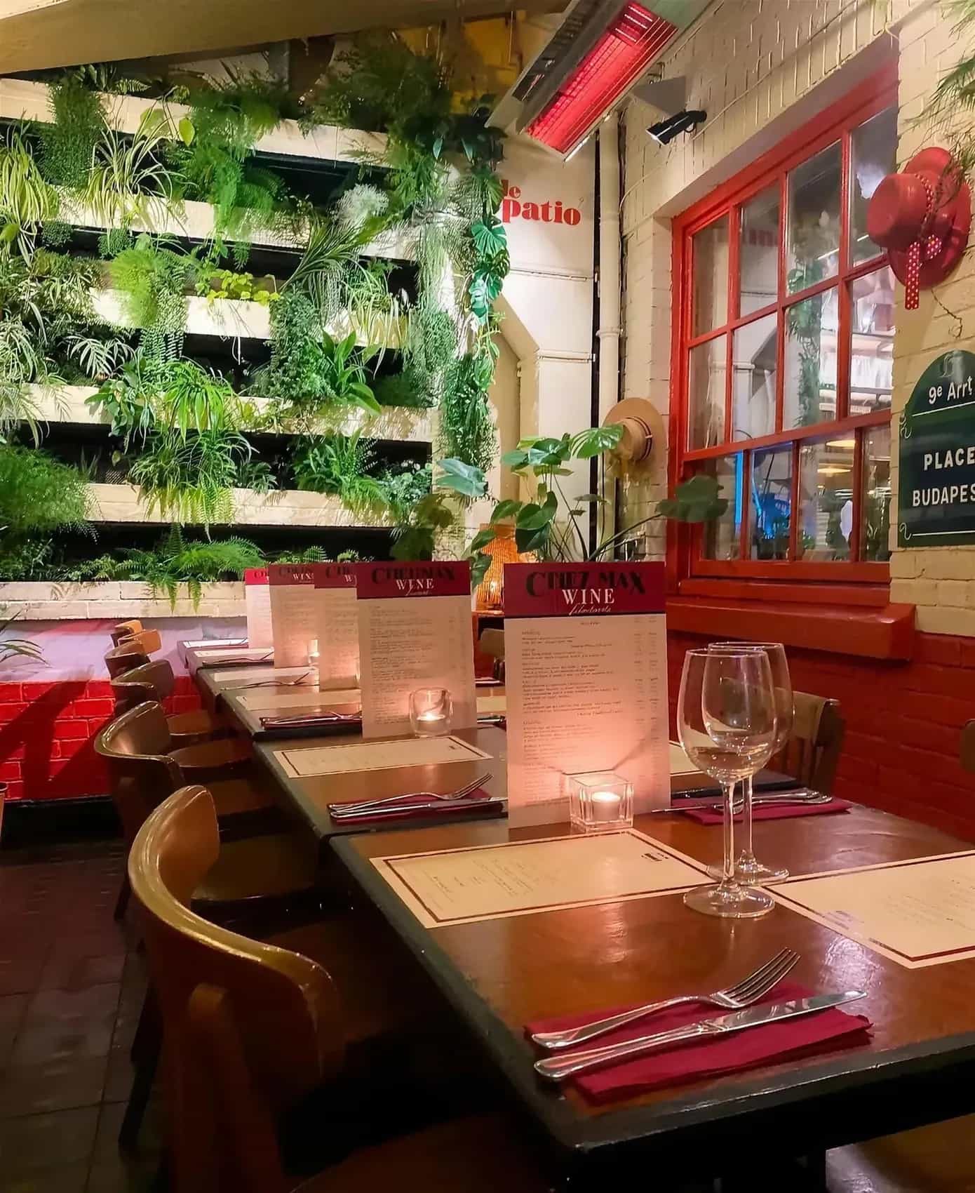 The heated patio of Chez Max on Palace Street, tables dressed beside the gates of Dublin Castle